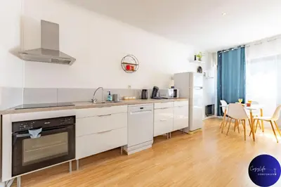 Cuisine ou kitchenette dans l'établissement La Chrysalide by CozyLife - Centre Ville