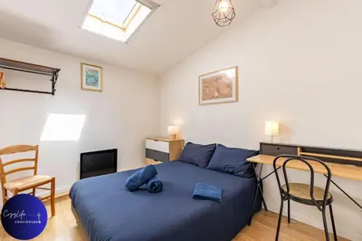 Un ou plusieurs lits dans un hébergement de l'établissement La Chrysalide by CozyLife - Centre Ville