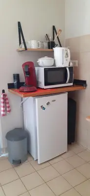 Cuisine ou kitchenette dans l'établissement Chambre indépendante et coin repas proche Futuroscope et Civaux