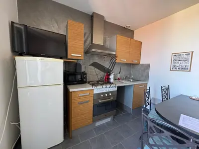 Cuisine ou kitchenette dans l'établissement ARISTIDE 4 - Appartement idéalement située