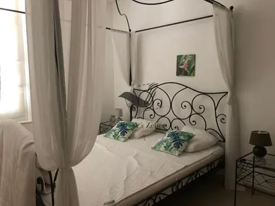 Un ou plusieurs lits dans un hébergement de l'établissement ARISTIDE 5 - Appartement idéalement situé
