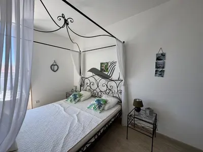 Un ou plusieurs lits dans un hébergement de l'établissement ARISTIDE 5 - Appartement idéalement situé