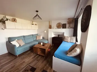 Coin salon dans l'établissement Charmante maison de campagne
