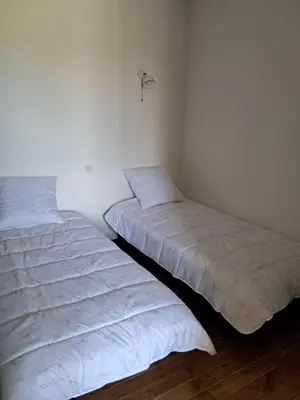 Un ou plusieurs lits dans un hébergement de l'établissement Gîte La Maison des Arts