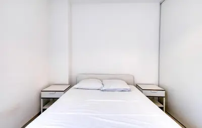 Un ou plusieurs lits dans un hébergement de l'établissement Appartement Proche Plage