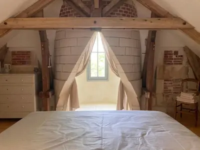 Un ou plusieurs lits dans un hébergement de l'établissement Manoir de Plaisance