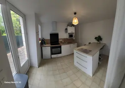 Cuisine ou kitchenette dans l'établissement Logement Douce évasion