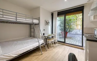 Un ou plusieurs lits dans un hébergement de l'établissement Appartement Proche Plage