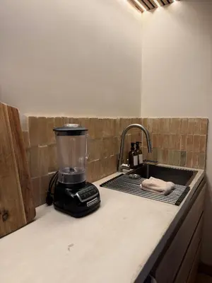 Cuisine ou kitchenette dans l'établissement Cocon avec jacuzzi