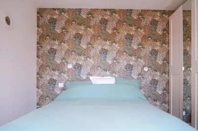 Un ou plusieurs lits dans un hébergement de l'établissement Cottage du golf de saint laurent de la prée