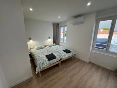 Un ou plusieurs lits dans un hébergement de l'établissement Villa Champs et Mer