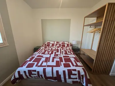 Un ou plusieurs lits dans un hébergement de l'établissement L'appartement de Julien
