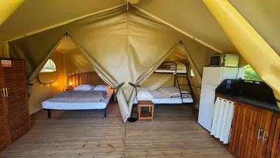 Un ou plusieurs lits dans un hébergement de l'établissement camping ile aux loisirs
