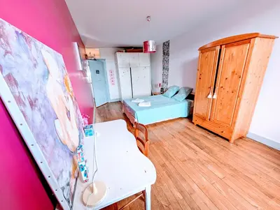 Coin salon dans l'établissement Maison Galice à Lusignan village médiéval - Base loisir gratuite- 30 min Futuroscope