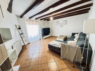 Télévision ou salle de divertissement dans l'établissement Maison cosy