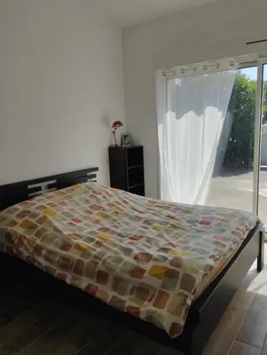 Un ou plusieurs lits dans un hébergement de l'établissement Studio cosy près de La Rochelle