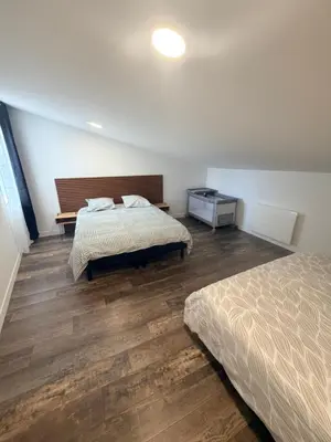 Un ou plusieurs lits dans un hébergement de l'établissement Petite maison chez l habitant