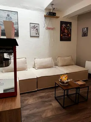Coin salon dans l'établissement Le Cocon - Appartement avec salle de Cinéma