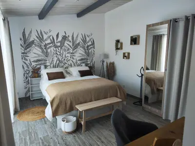 Un ou plusieurs lits dans un hébergement de l'établissement Cottage Escale Nature & Sérénité - spa privatif