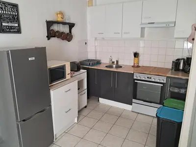 Cuisine ou kitchenette dans l'établissement Petite maison de bourg