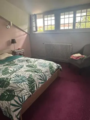 Un ou plusieurs lits dans un hébergement de l'établissement Chambre CHEZ L'HABITANT