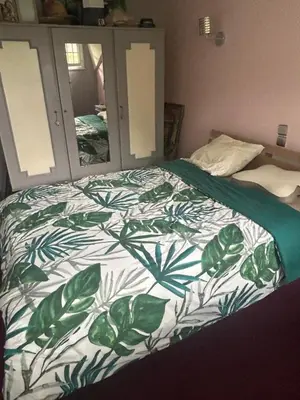 Un ou plusieurs lits dans un hébergement de l'établissement Chambre CHEZ L'HABITANT