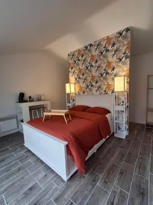 Un ou plusieurs lits dans un hébergement de l'établissement Chambre suite avec terrasse