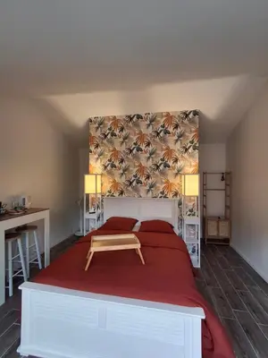 Un ou plusieurs lits dans un hébergement de l'établissement Chambre suite avec terrasse