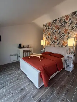 Un ou plusieurs lits dans un hébergement de l'établissement Chambre suite avec terrasse