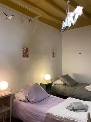 Un ou plusieurs lits dans un hébergement de l'établissement Villa Krystina Gîte de Charme
