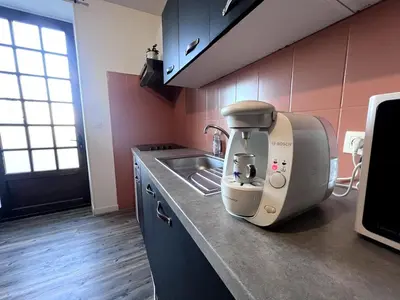 Cuisine ou kitchenette dans l'établissement Appartement Le Saloon - détente & BD