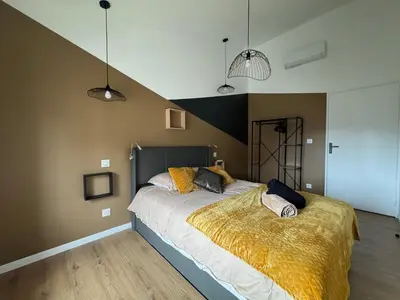 Un ou plusieurs lits dans un hébergement de l'établissement Casa Cosy
