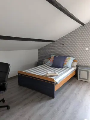 Un ou plusieurs lits dans un hébergement de l'établissement Apartment