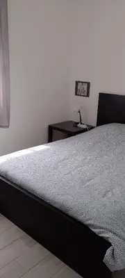 Un ou plusieurs lits dans un hébergement de l'établissement Chambre avec salle de bain et WC privés