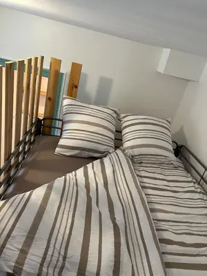 Un ou plusieurs lits dans un hébergement de l'établissement Cottage 50m de la plage