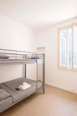 Un ou plusieurs lits dans un hébergement de l'établissement La chambre du minage
