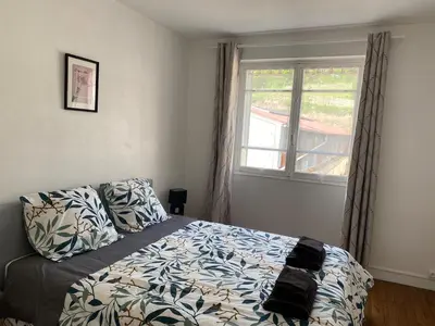 Un ou plusieurs lits dans un hébergement de l'établissement Cosy 2 bedroom apartment