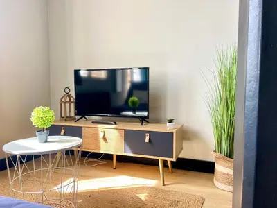 Télévision ou salle de divertissement dans l'établissement Les logements St Exupéry, à 4 min du Futuroscope