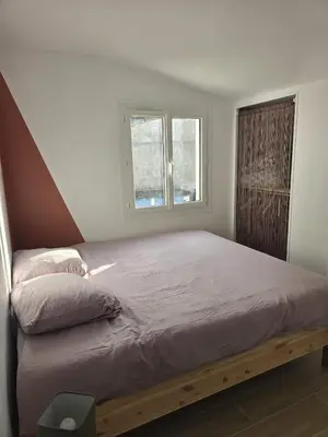 Un ou plusieurs lits dans un hébergement de l'établissement Maisonnette près de la plage