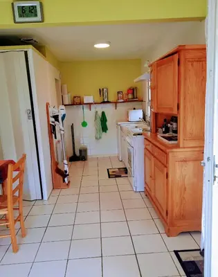 Cuisine ou kitchenette dans l'établissement Maisonnette 