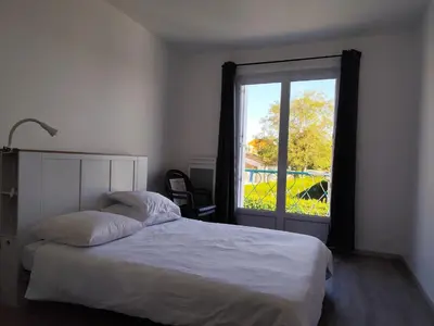 Un ou plusieurs lits dans un hébergement de l'établissement Appartement T3 idéalement situé