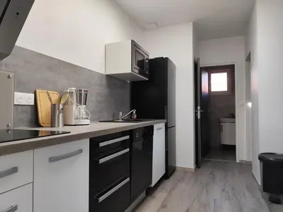 Cuisine ou kitchenette dans l'établissement Appartement T3 idéalement situé