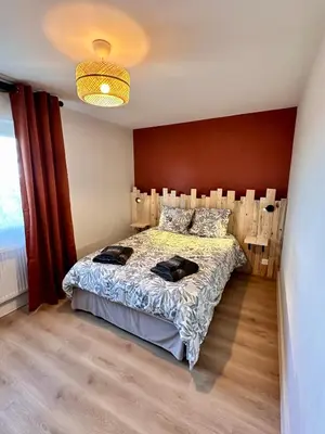 Un ou plusieurs lits dans un hébergement de l'établissement Maison avec Jardin 6 Couchages & Parking gratuit à proximité du Futuroscope