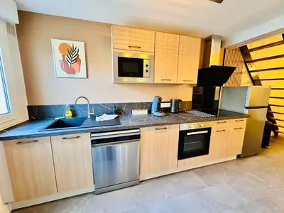 Cuisine ou kitchenette dans l'établissement Maison avec Jardin 6 Couchages & Parking gratuit à proximité du Futuroscope