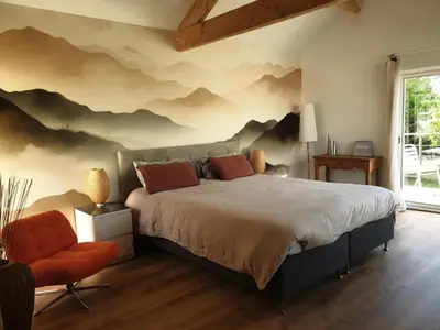 Un ou plusieurs lits dans un hébergement de l'établissement Chambre suite de charme