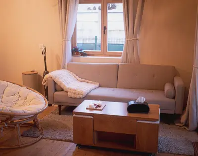 Coin salon dans l'établissement Chalet romantique - Jacuzzi privatif - King size