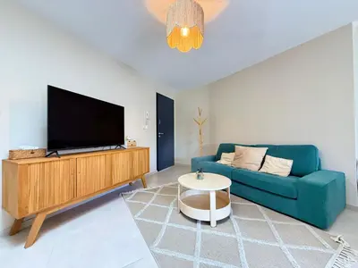 Télévision ou salle de divertissement dans l'établissement Le Spacieux Carat - Terrasse