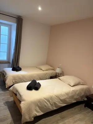 Un ou plusieurs lits dans un hébergement de l'établissement Maison au calme