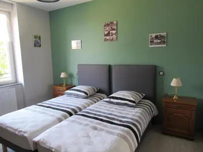 Un ou plusieurs lits dans un hébergement de l'établissement Le gite de la butte