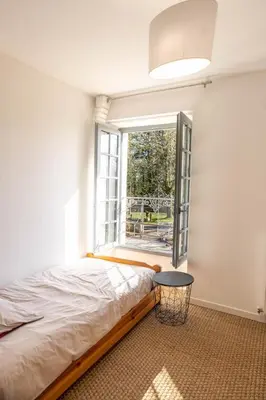 Un ou plusieurs lits dans un hébergement de l'établissement Le gite du manoir